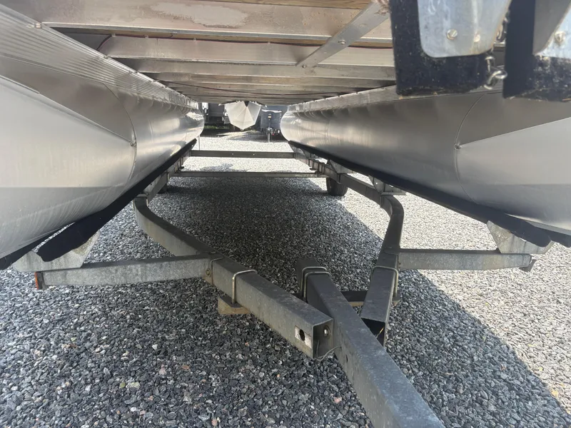 Slide: The Image of Underneath view of a 2009 Avalon Paradise 24' pontoon boat on a trailer. - 6