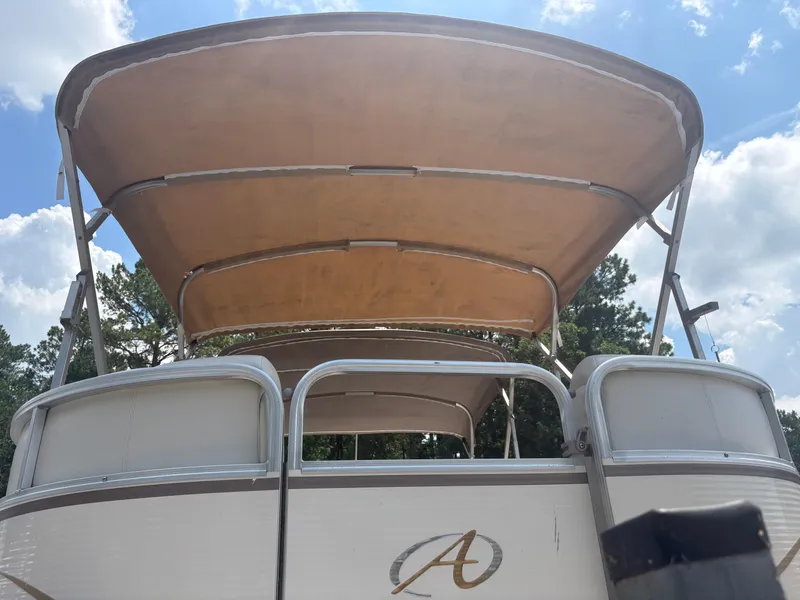 Slide: The Image of 2009 Avalon Paradise 24' pontoon boat with canopy, viewed from the rear. - 7