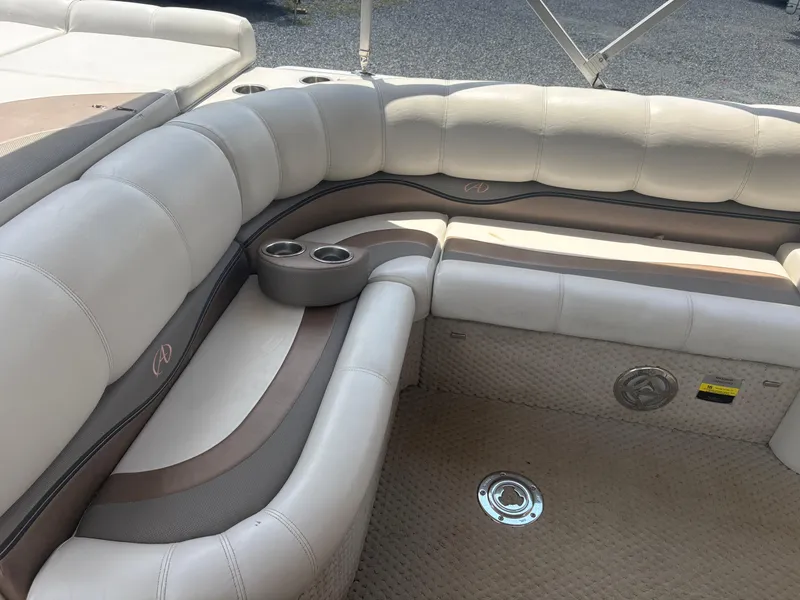 Slide: The Image of Luxurious seating on a 2009 Avalon Paradise 24' boat with cup holders and speaker. - 9