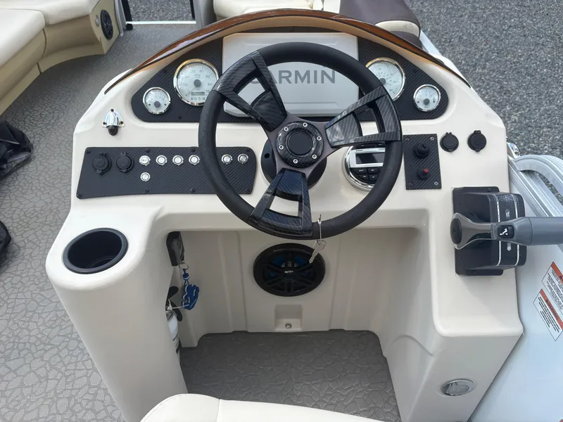 Slide: The Image of Steering console of a 2021 Lexington 321 boat with Garmin navigation system. - 12