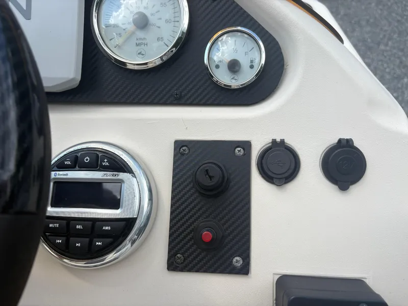 Slide: The Image of Dashboard of a 2021 Lexington 321 with gauges, controls, and Bluetooth stereo system. - 15