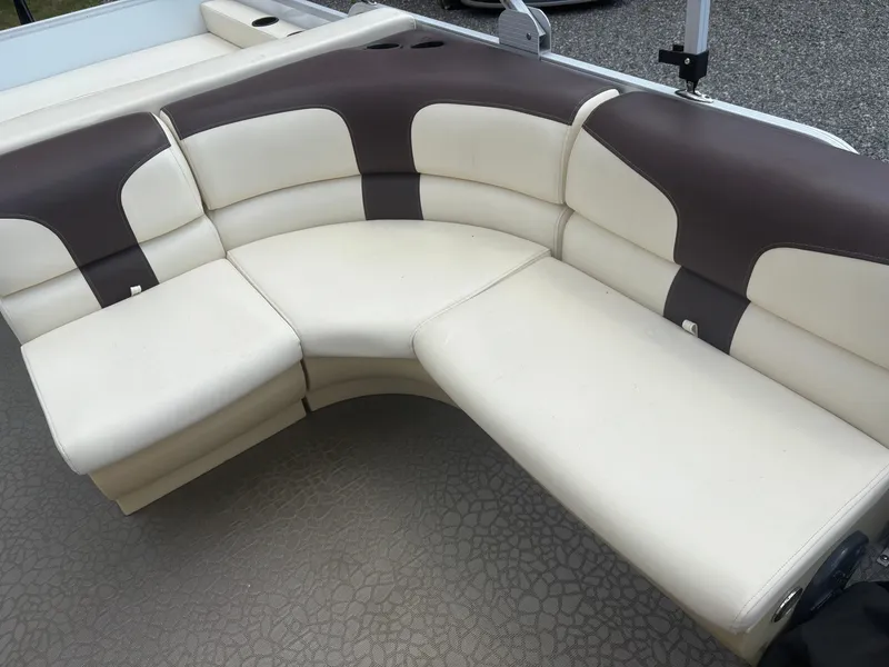 Slide: The Image of Luxurious beige and brown seating on a 2021 Lexington 321 boat. - 16