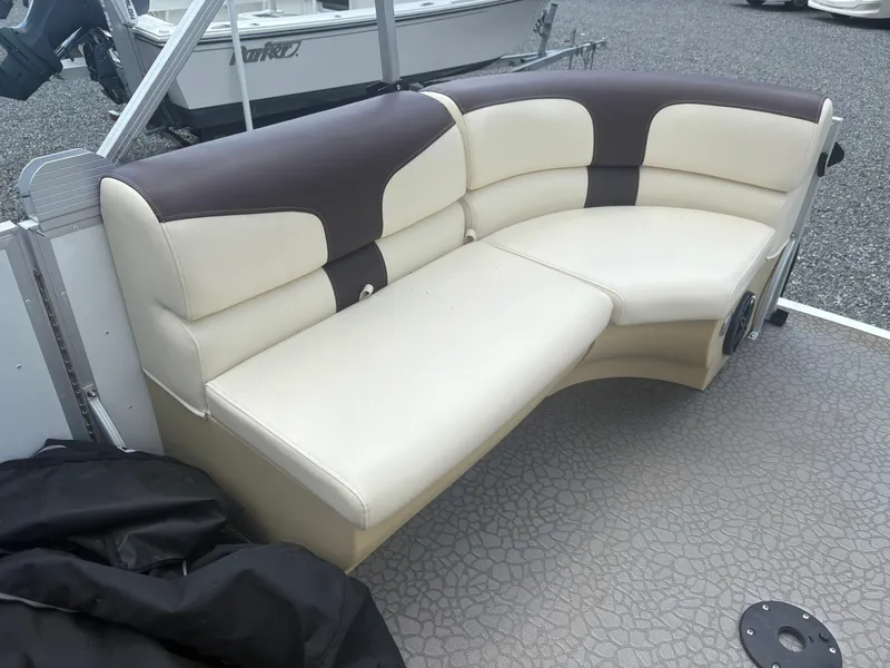Slide: The Image of Luxurious beige and brown seating on a 2021 Lexington 321 boat. - 17