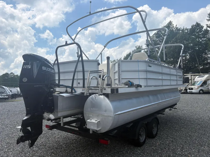 Slide: The Image of 2021 Lexington 321 pontoon boat with Suzuki 115 engine, parked on gravel lot. - 5