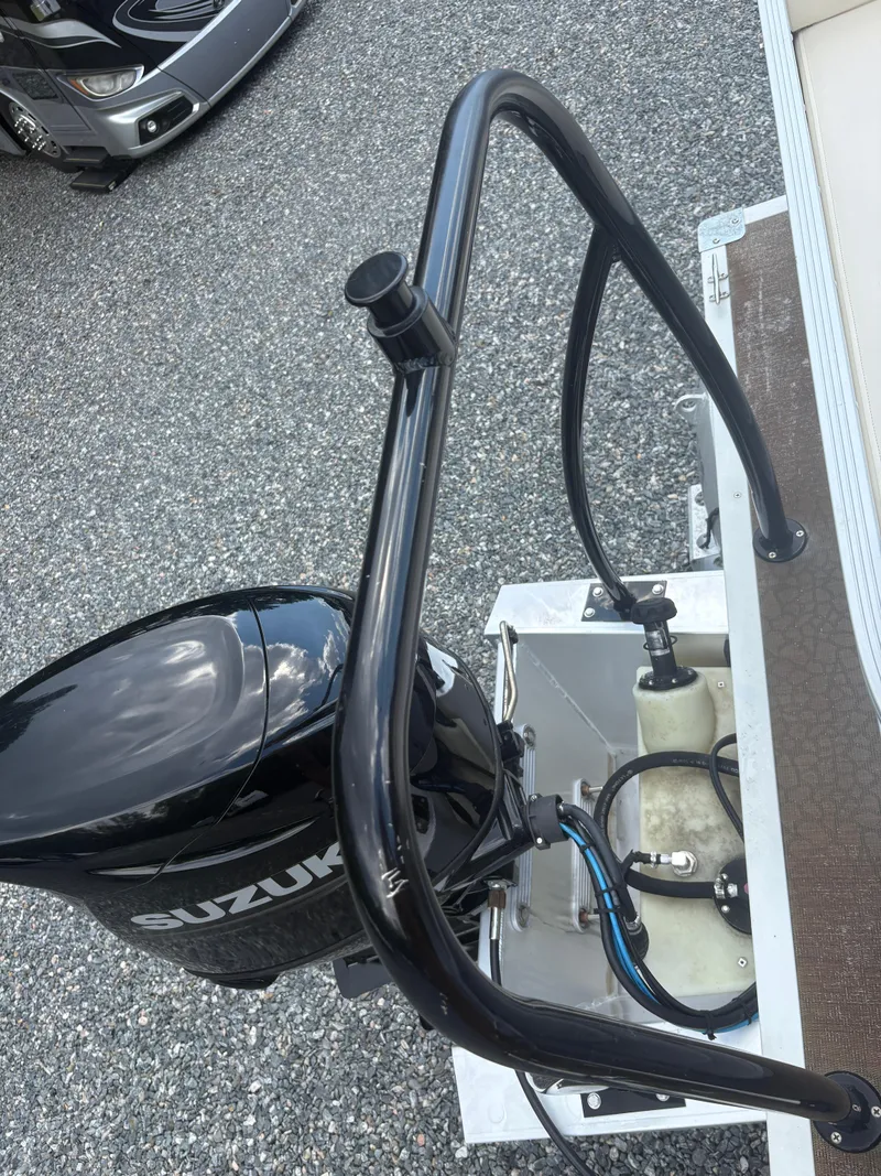 Slide: The Image of Outboard motor on a 2021 Lexington 321 boat, featuring Suzuki branding. - 9