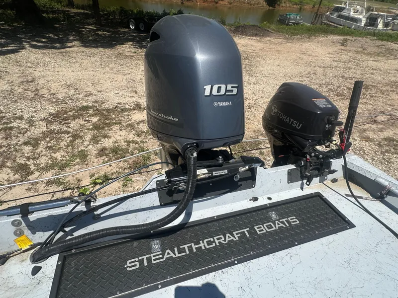 Slide: The Image of 2023 StealthCraft Stealthweld 18 boat with Yamaha and Tohatsu outboard motors. - 22