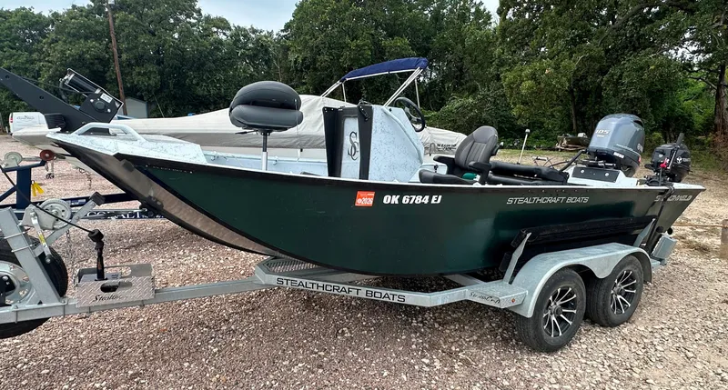 Slide: The Image of 2023 StealthCraft Stealthweld 18 boat on trailer, parked outdoors. - 3
