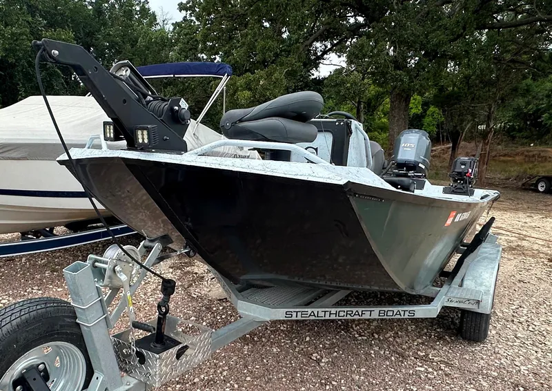 Slide: The Image of 2023 StealthCraft Stealthweld 18 boat on trailer, parked outdoors. - 4
