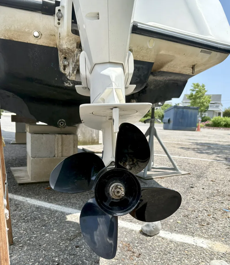 Slide: The Image of Propeller of a 1999 Century 2300 Center Console boat on a trailer. - 13