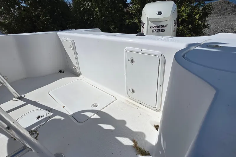 Slide: The Image of 1999 Century 2300 Center Console boat with Evinrude 225 engine, white deck view. - 23