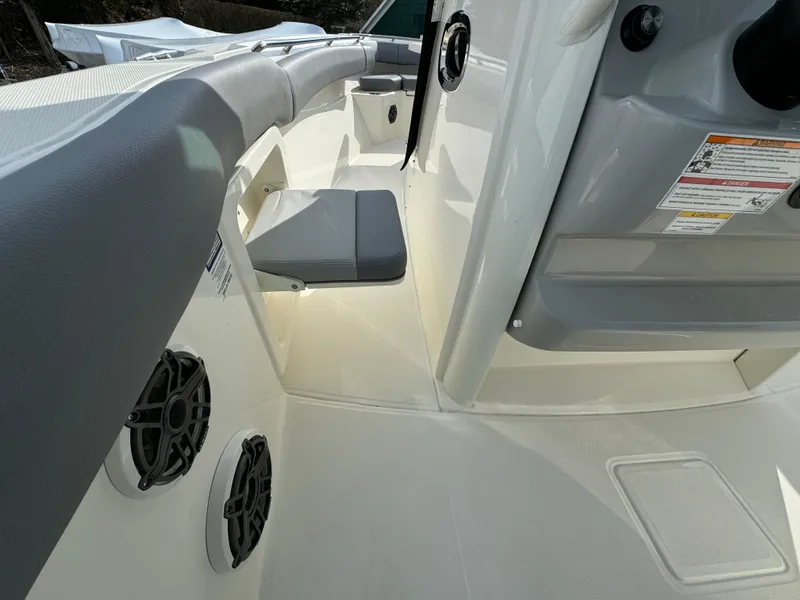 Slide: The Image of 2025 Boston Whaler 280 Outrage interior with seating and speaker system. - 23
