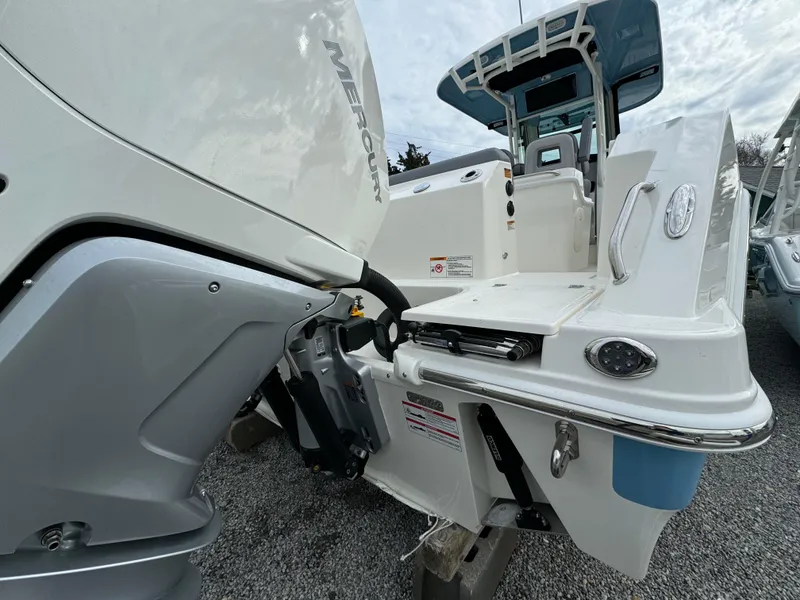 Slide: The Image of 2025 Boston Whaler 280 Outrage boat with Mercury engine, rear view. - 3