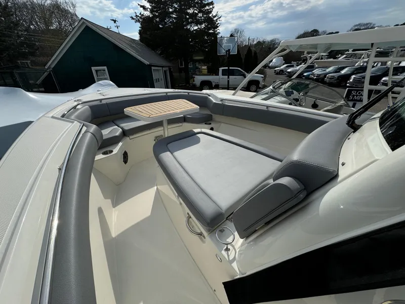 Slide: The Image of 2025 Boston Whaler 280 Outrage boat interior with seating and table. - 30