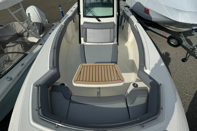Slide: The Image of 2025 Boston Whaler 280 Outrage boat interior with seating and table. - 31