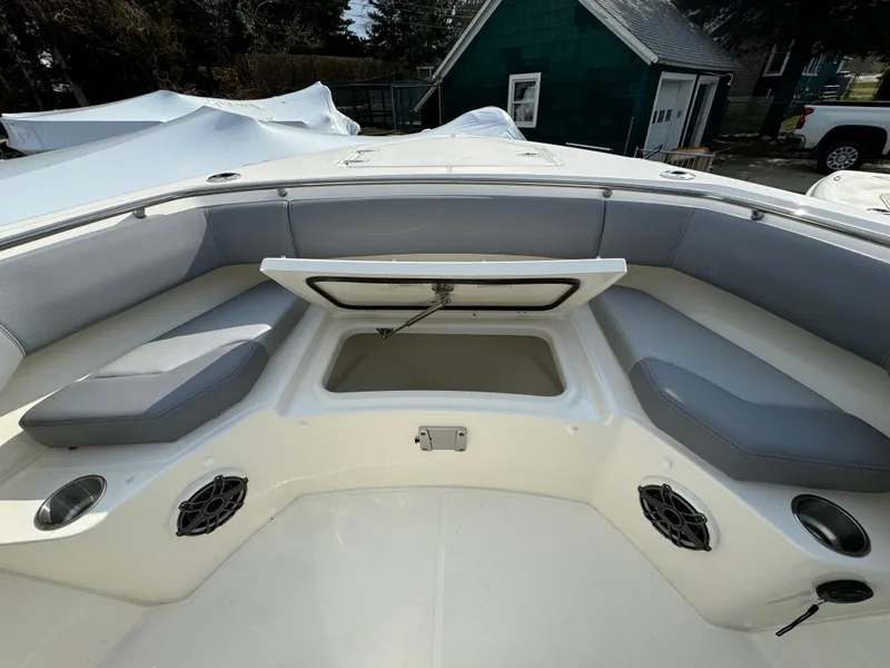 Slide: The Image of 2025 Boston Whaler 280 Outrage boat interior with seating and storage compartment. - 32