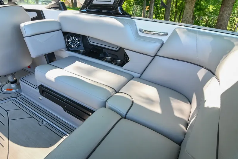 Slide: The Image of 2021 Moomba Kaiyen boat interior with gray seating and speaker system. - 17