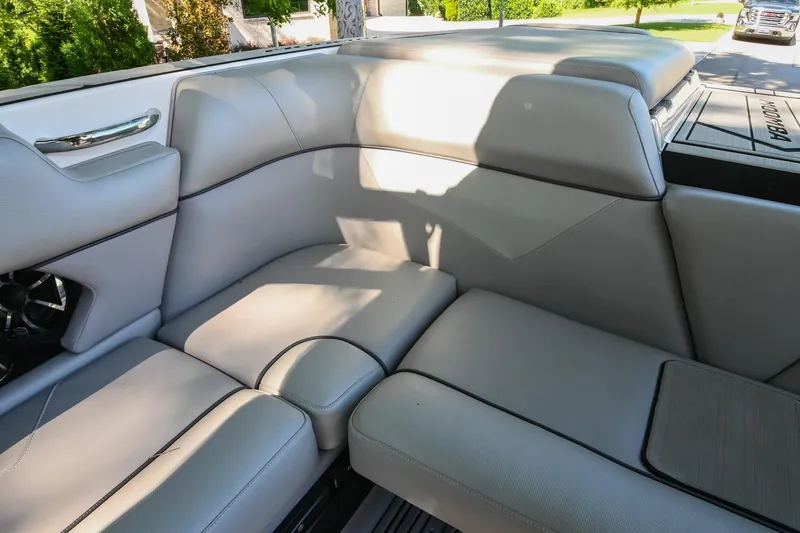 Slide: The Image of 2021 Moomba Kaiyen boat interior with luxurious gray seating and sleek design. - 18