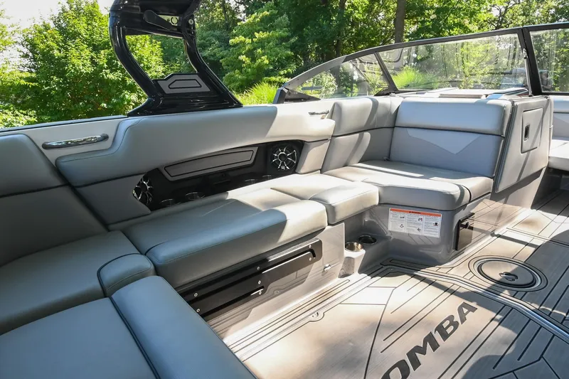 Slide: The Image of 2021 Moomba Kaiyen boat interior with gray seating and modern design. - 21