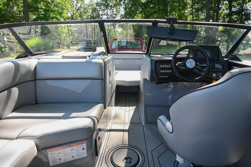 Slide: The Image of 2021 Moomba Kaiyen boat interior with sleek seating and modern dashboard design. - 24