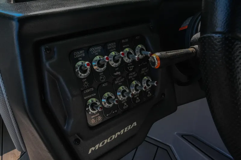 Slide: The Image of Control panel of a 2021 Moomba Kaiyen boat with various switches and labels. - 27
