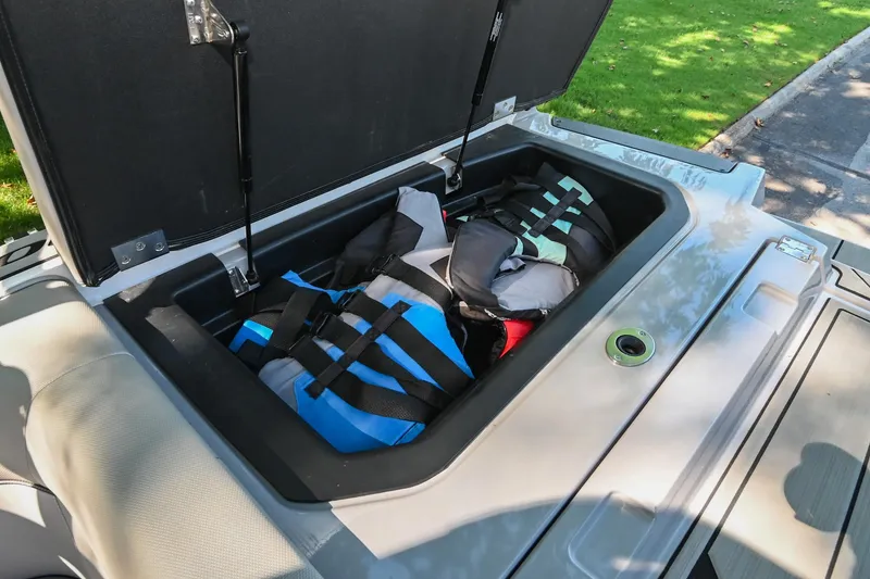 Slide: The Image of 2021 Moomba Kaiyen storage compartment with life jackets inside. - 36