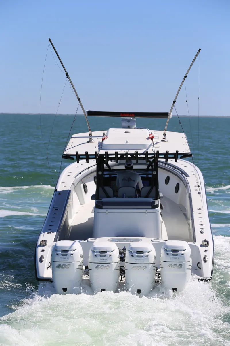 Slide: The Image of 2018 Yellowfin 39 boat with four engines cruising on open water. - 15