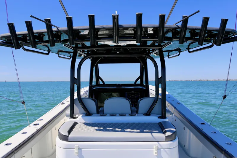 Slide: The Image of 2018 Yellowfin 39 boat on open water, featuring spacious seating and rod holders. - 22