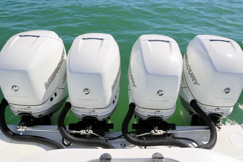 Slide: The Image of Four Mercury outboard engines on a 2018 Yellowfin 39 boat in water. - 26