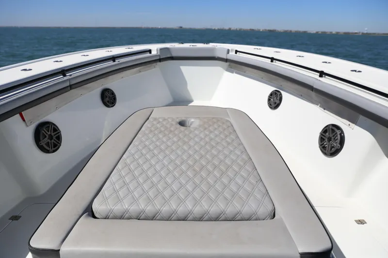 Slide: The Image of 2018 Yellowfin 39 boat interior with cushioned seating and ocean view. - 27
