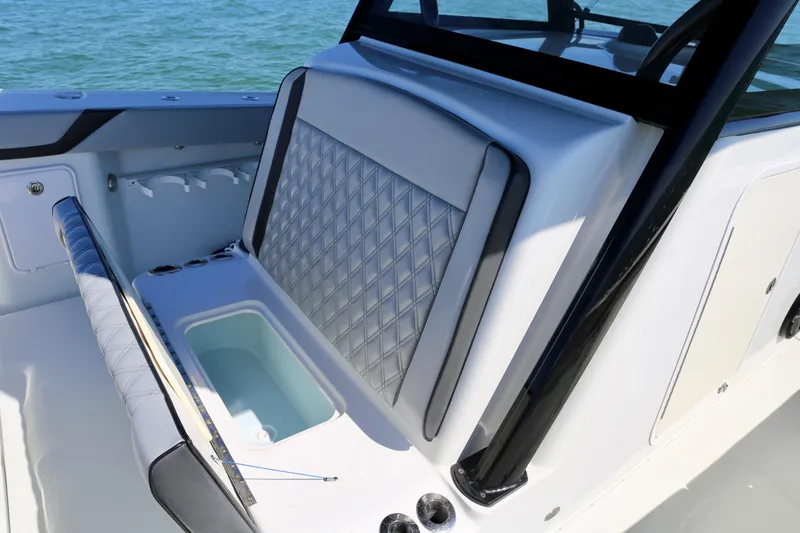 Slide: The Image of 2018 Yellowfin 39 boat interior with diamond-stitched seating and built-in storage compartment. - 28