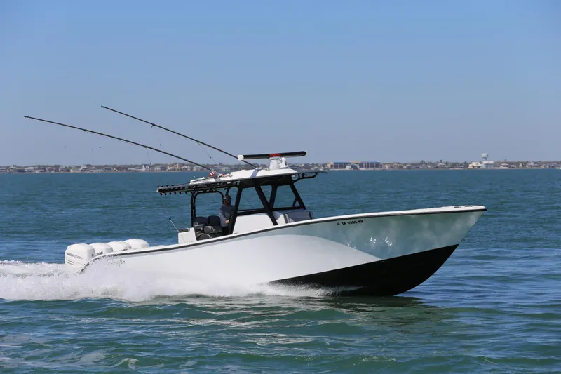 Slide: The Image of 2018 Yellowfin 39 boat cruising on open water with fishing rods. - 5