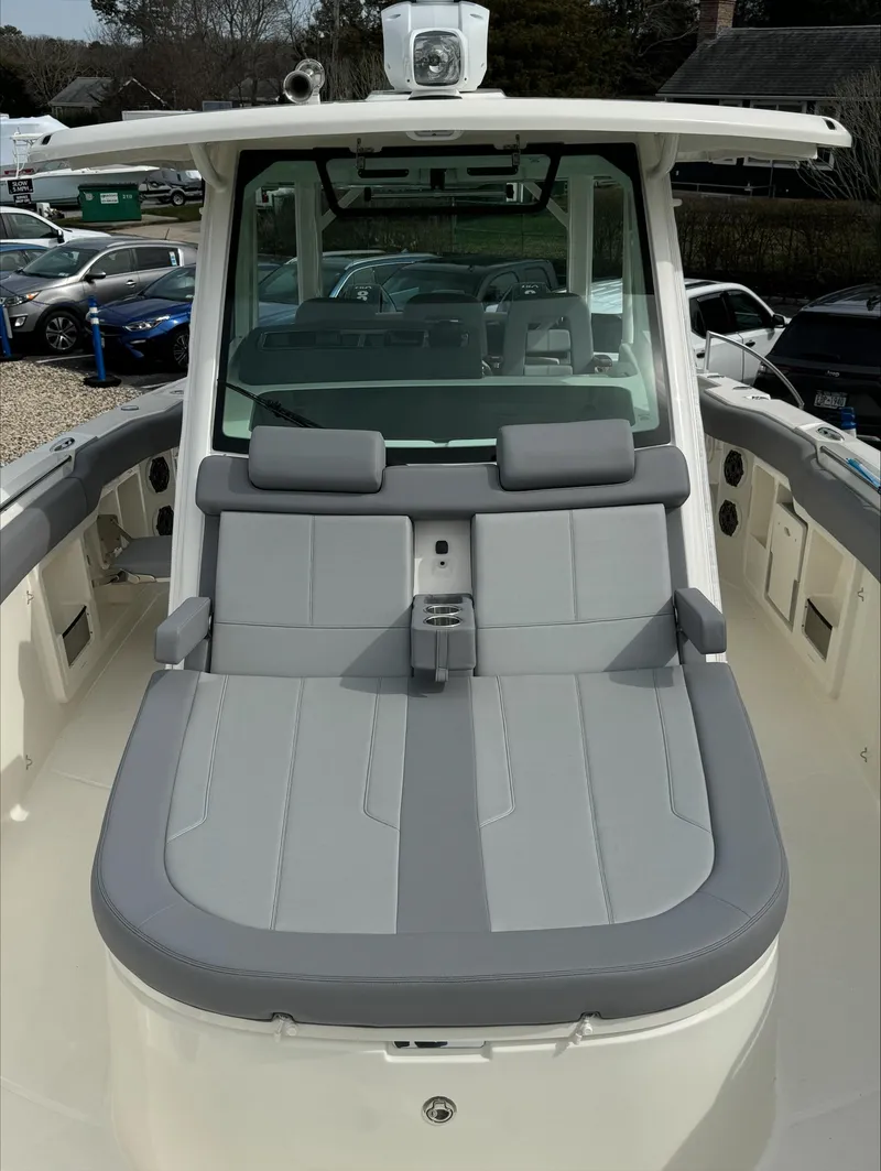 Slide: The Image of 2025 Boston Whaler 380 Outrage boat with sleek gray seating and modern design. - 34