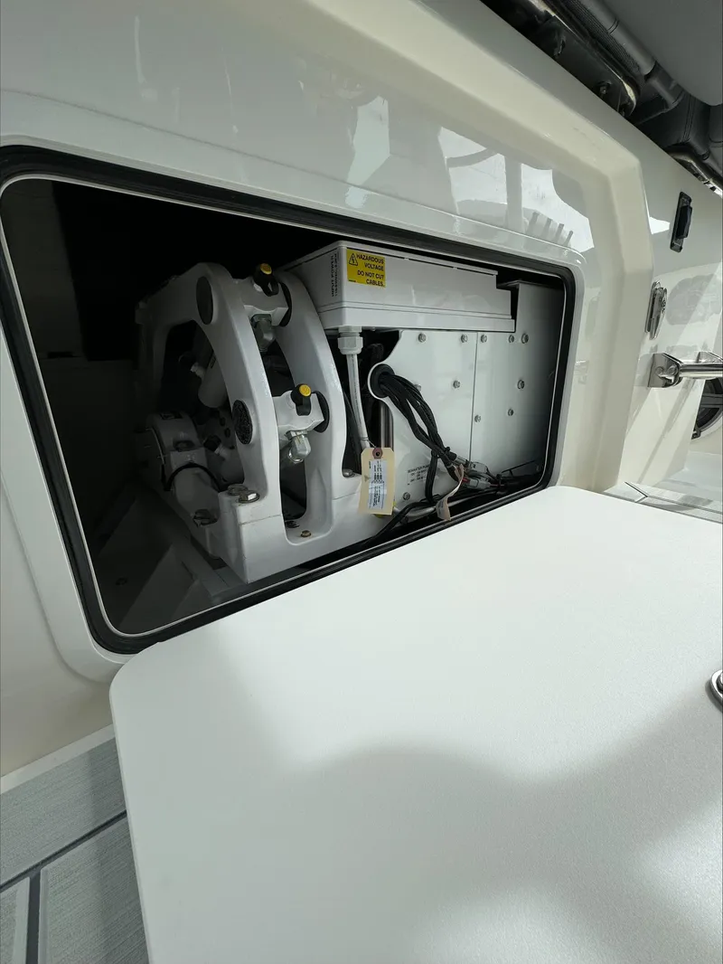 Slide: The Image of 2025 Boston Whaler 380 Outrage engine compartment detail, showcasing mechanical components. - 35