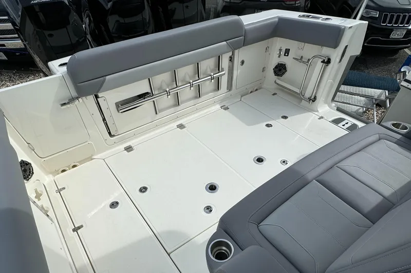 Slide: The Image of 2025 Boston Whaler 380 Outrage boat interior with seating and storage compartments. - 4