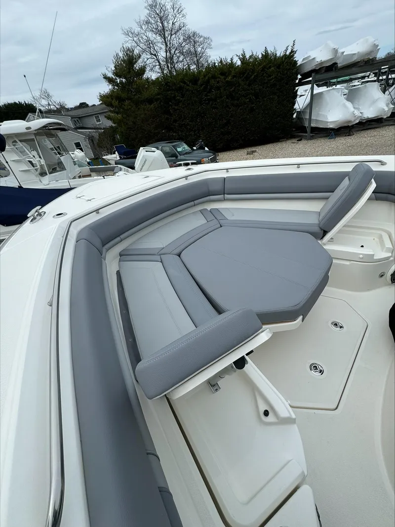 Slide: The Image of 2025 Boston Whaler 380 Outrage boat with spacious seating and sleek design. - 40