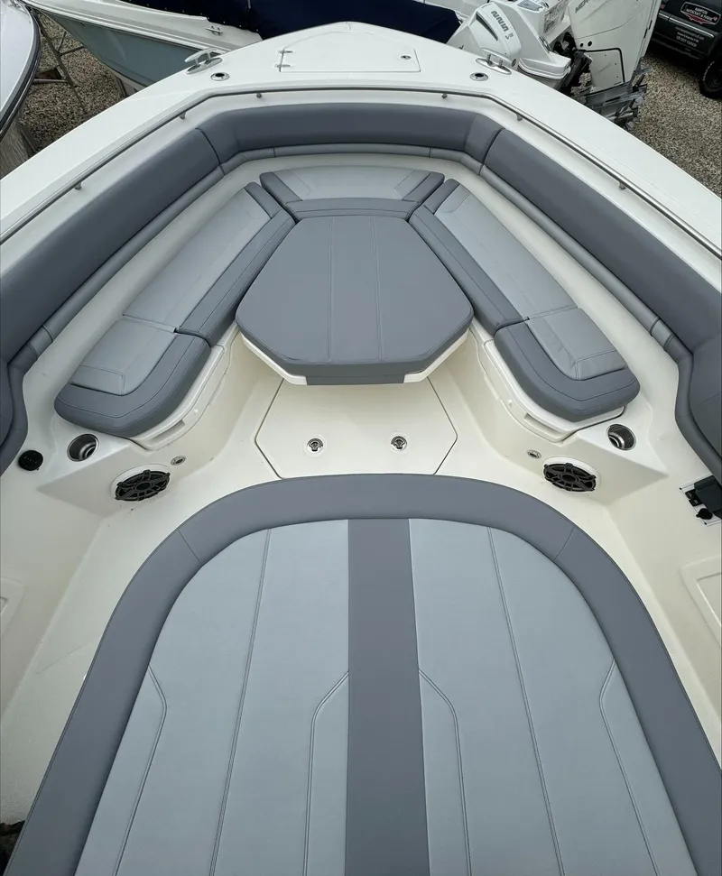 Slide: The Image of 2025 Boston Whaler 380 Outrage boat interior with gray cushioned seating. - 41