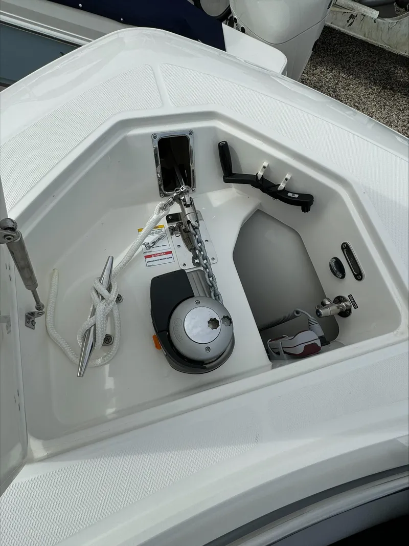 Slide: The Image of 2025 Boston Whaler 380 Outrage anchor compartment with chain and rope. - 43