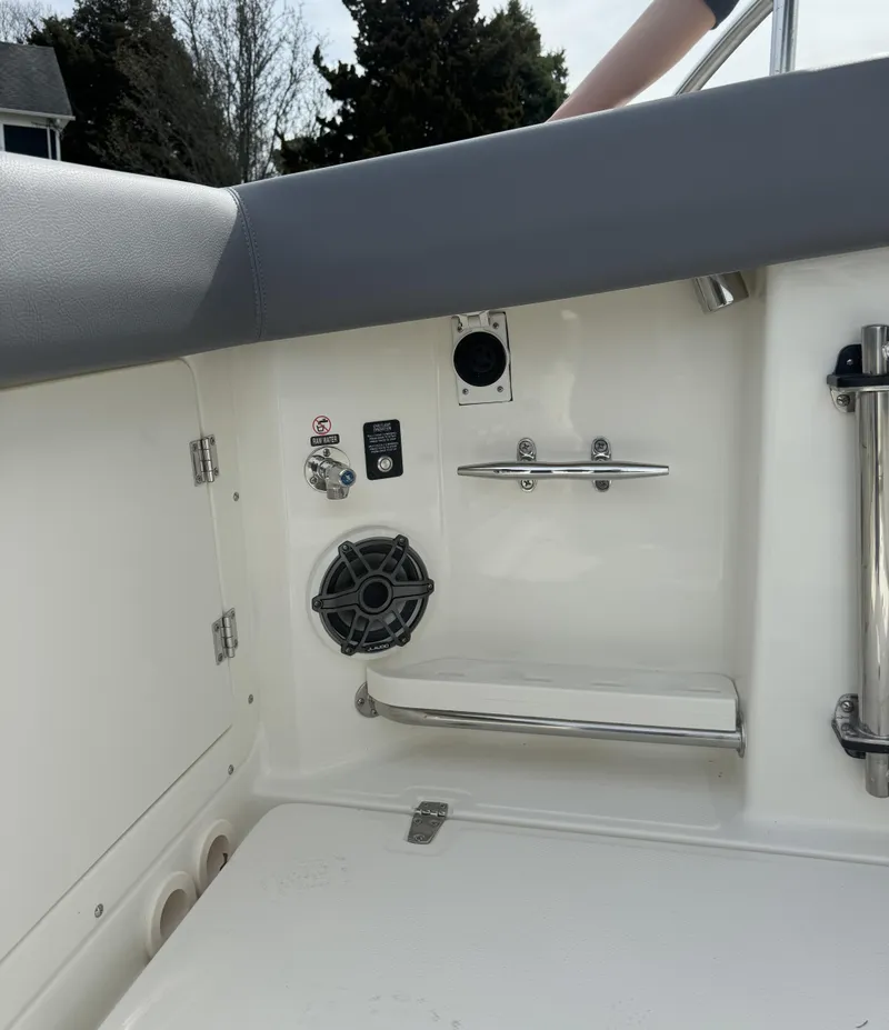 Slide: The Image of Interior view of 2025 Boston Whaler 380 Outrage boat, featuring speaker and stainless steel fittings. - 8