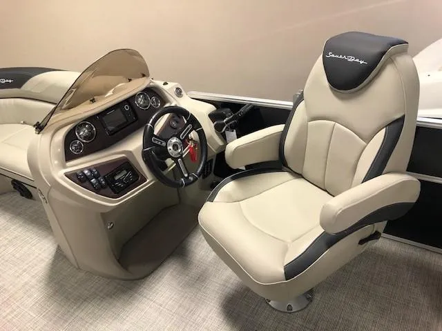 Slide: The Image of 2023 South Bay 224RS LE 2.75 boat interior with captain's chair and control console. - 3
