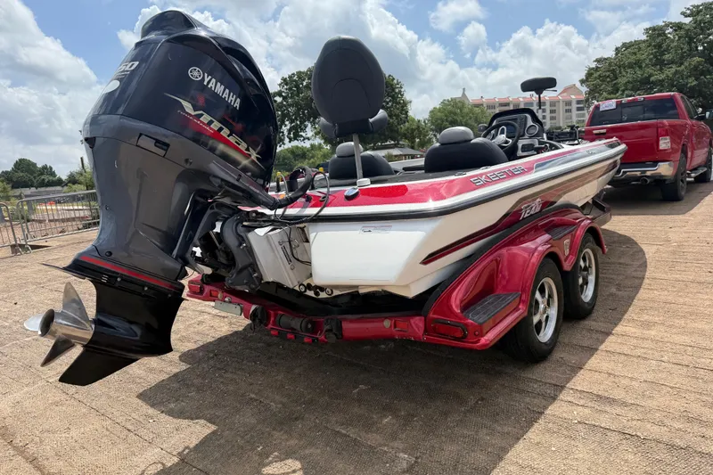 Slide: The Image of 2011 Skeeter FX 21 boat with Yamaha engine on a red trailer. - 12