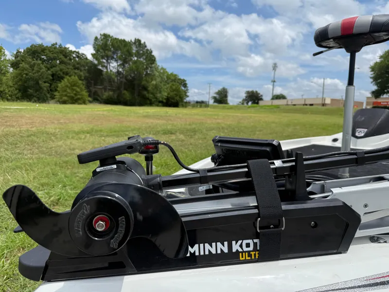Slide: The Image of 2011 Skeeter FX 21 boat with Minn Kota Ultrex trolling motor in grassy field. - 31