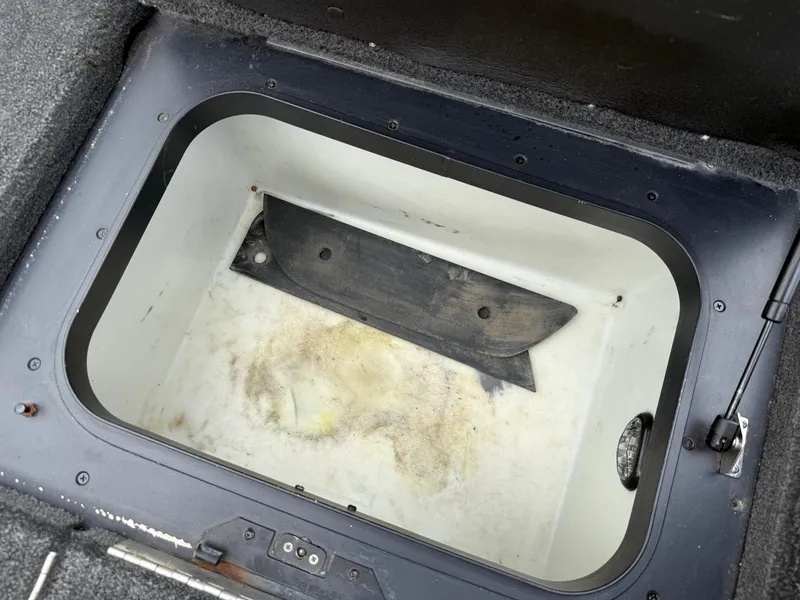 Slide: The Image of Storage compartment of a 2011 Skeeter FX 21 boat, showing interior details. - 42