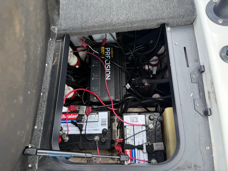 Slide: The Image of 2011 Skeeter FX 21 boat battery compartment with wiring and Precision charger. - 44