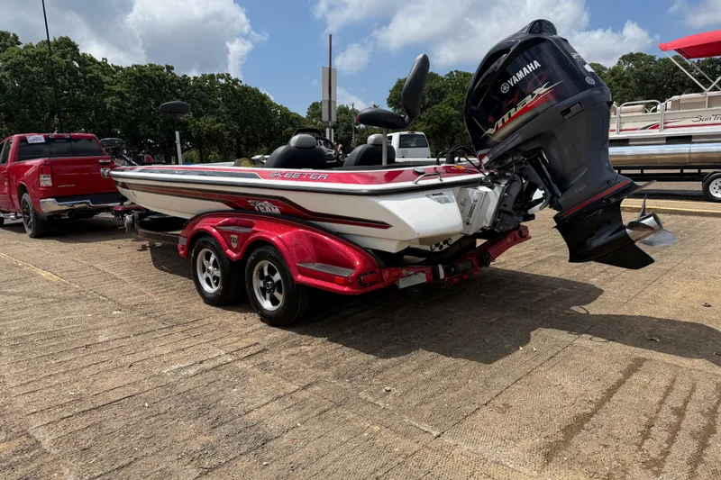 Slide: The Image of 2011 Skeeter FX 21 boat on trailer with Yamaha outboard motor. - 8