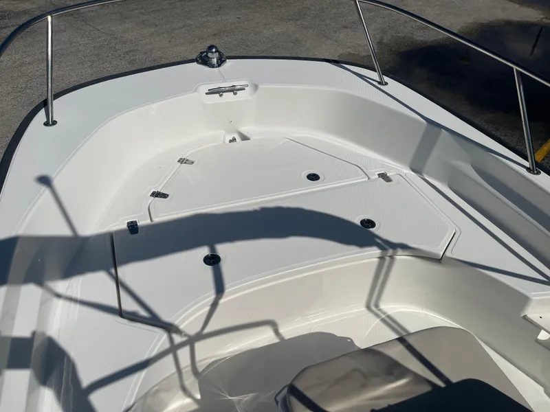 Slide: The Image of 2022 Boston Whaler 170 Montauk boat deck with storage compartments and railing. - 7
