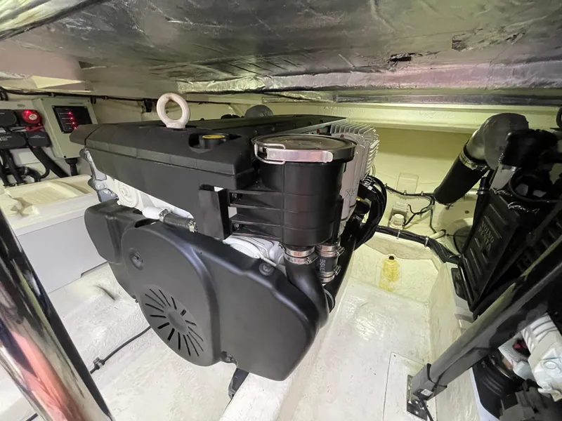 Slide: The Image of Engine room of a 2017 Riviera 3600 Sport Yacht, showcasing mechanical components. - 10