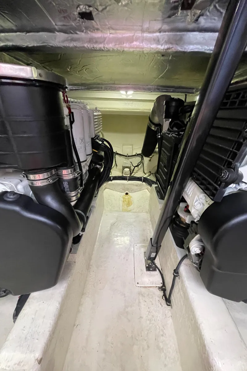 Slide: The Image of Engine room of 2017 Riviera 3600 Sport Yacht, showcasing dual engines and mechanical components. - 11