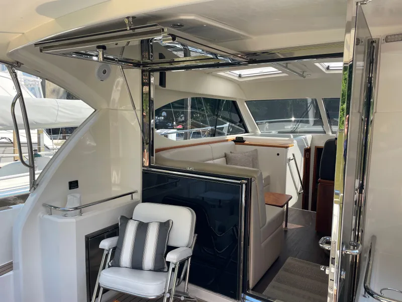 Slide: The Image of 2017 Riviera 3600 Sport Yacht interior with seating and modern design elements. - 18