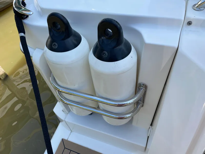 Slide: The Image of Fenders on a 2017 Riviera 3600 Sport Yacht, secured with stainless steel holders. - 21