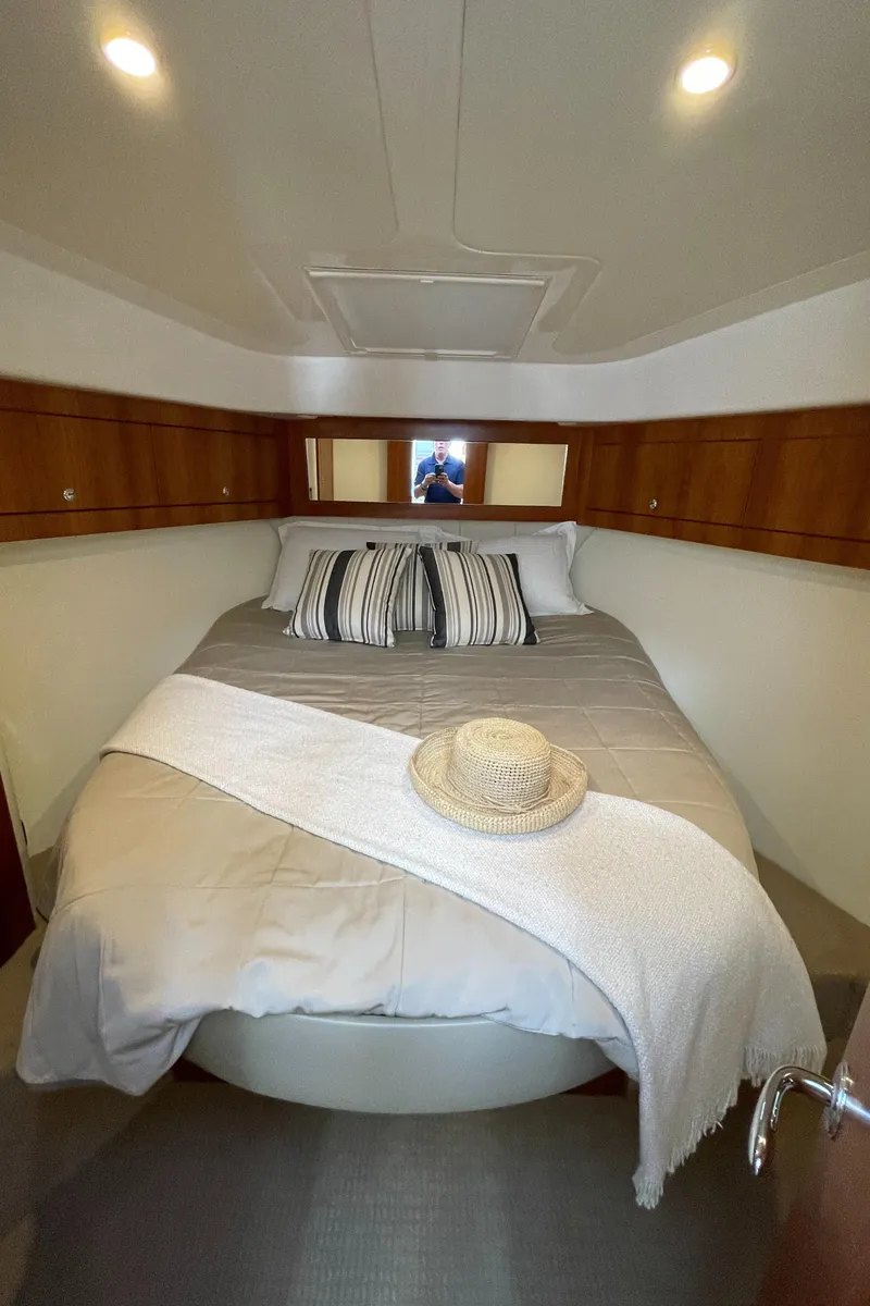 Slide: The Image of Cozy bedroom in 2017 Riviera 3600 Sport Yacht with elegant bedding and decor. - 37
